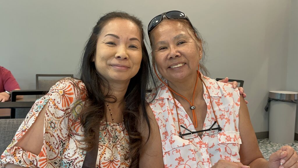 Sunantha Potang and her mother smiling together, illustrating the power of practicing Nichiren Buddhism to heal family relationships.
