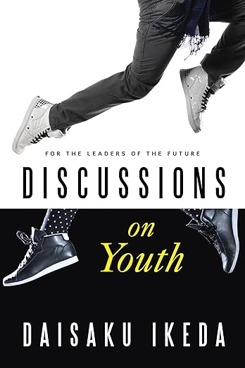 Cover of the book "Discussions on Youth" by Daisaku Ikeda, featuring a black background with a silhouettes of young people jumping with joy.